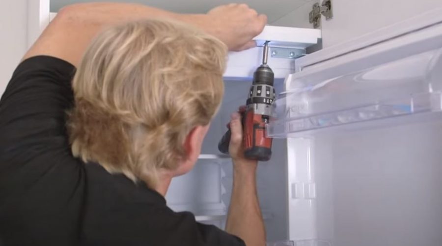Then plug in and place the refrigerator in the high cabinet